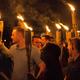 White nationalists carry torches on the grounds of the University of Virginia, on the eve of a planned Unite The Right rally in Charlottesville, Virginia, U.S. August 11, 2017. Picture taken August 11, 2017. Alejandro Alvarez/News2Share via REUTERS. MANDATORY CREDIT. NO RESALES. NO ARCHIVES - RTS1BG2B